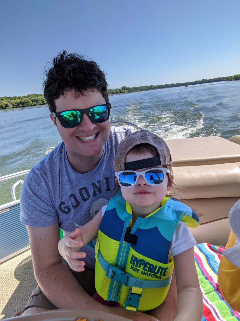 Adam, creator of Gourmet Gus, on a summer boat ride up North with his daughter.