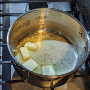 Melting butter the base start of creating this basic white sauce / bechamel recipe